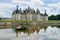 Young couple boating in the canal of the castle Chambord