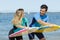 Young couple bodyboard surfers