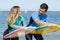 young couple bodyboard surfers training