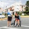 Young couple with broken arm and leg coming out of the hospital in travel insurance concept