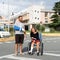 Young couple with broken arm and leg coming out of the hospital in travel insurance concept