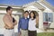 Young couple buying house holding keys