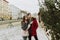 A young couple buys a Christmas tree at the market in their home. Concept - a symbol of the Christmas and New Year holidays