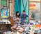 A young couple buys a teapot in a small store on the market in the old city of Acre in Israel