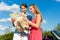 Young couple with cabriolet in summer on day trip