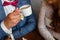 Young couple in a cafe in the attic drinking coffee and tea, sitting. Morning breakfast at the hotel. Cropped image of couple in l