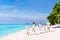 Young couple with child and grandparents on beach