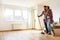 Young Couple Choosing Colors for Painting their Home