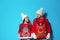 Young couple in Christmas sweaters and knitted hats