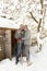 Young Couple Clearing Snow