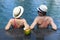 Young couple coconut cocktail near swimming pool