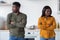 Young Couple Conflict. Offended Black Man And Woman Standing In Kitchen