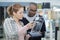 Young couple in consumer electronics store