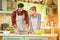 Young couple cooking vegetables.