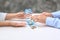 Young couple counting money at table