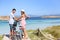 Young couple discovering beautiful island on bikes