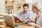 Young couple discussing finances at kitchen