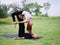 Young couple doing acro bird yoga pose. Healthy lifestyle modern activity.