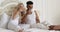 Young couple drink coffee in bed, happy smile woman man lovers, love romantic morning