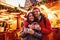 Young couple with drinks on Christmas market