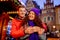 Young couple with drinks on Christmas market