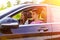 Young couple driving in a new car