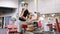 Young couple with dumbbells flexing muscles in gym