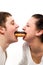 young couple eating donut