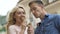 Young couple eating ice-cream and laughing, enjoying romantic date, close-up