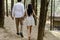 Young couple enjoying a leisurely stroll through a tranquil forest