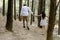 Young couple enjoying a leisurely stroll through a tranquil forest