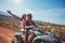 Young couple enjoying quad bike ride