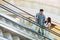 Young couple on escalator