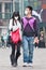 Young couple with face mask in smog blanketed city, Beijing, China