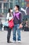 Young couple with face mask in smog blanketed city, Beijing, China