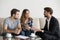 Young couple, family at meeting with realtor, interior designer