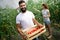 Young couple farming vegetables