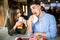 Young couple in a fast food restaurant eating hamburger and doner