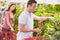 Young couple flirting in supermarket aisle