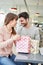 Young couple flirts in a shopping break