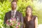 Young Couple at the Garden with Bouquet of Flowers