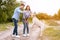 Young couple giving a treat to their happy dog