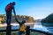 Young couple happy Enjoying nature tourism, watching the beautiful lake