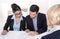 Young couple has consultation with consultant at desk at office.