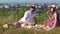 Young couple have a picnic by the cityview