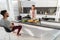 Young Couple Having Breakfast, Asian Woman Hispanic Man Cooking Food Kitchen