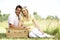 Young couple having picnic in countryside