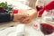 Young couple having romantic dinner in the restaurant holding hand drinking close-up