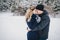 Young couple having a walk in snowy countryside