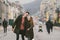 Young couple, heterosexual boy and girl of Caucasian nationality, loving couple, walk around the center of country of European